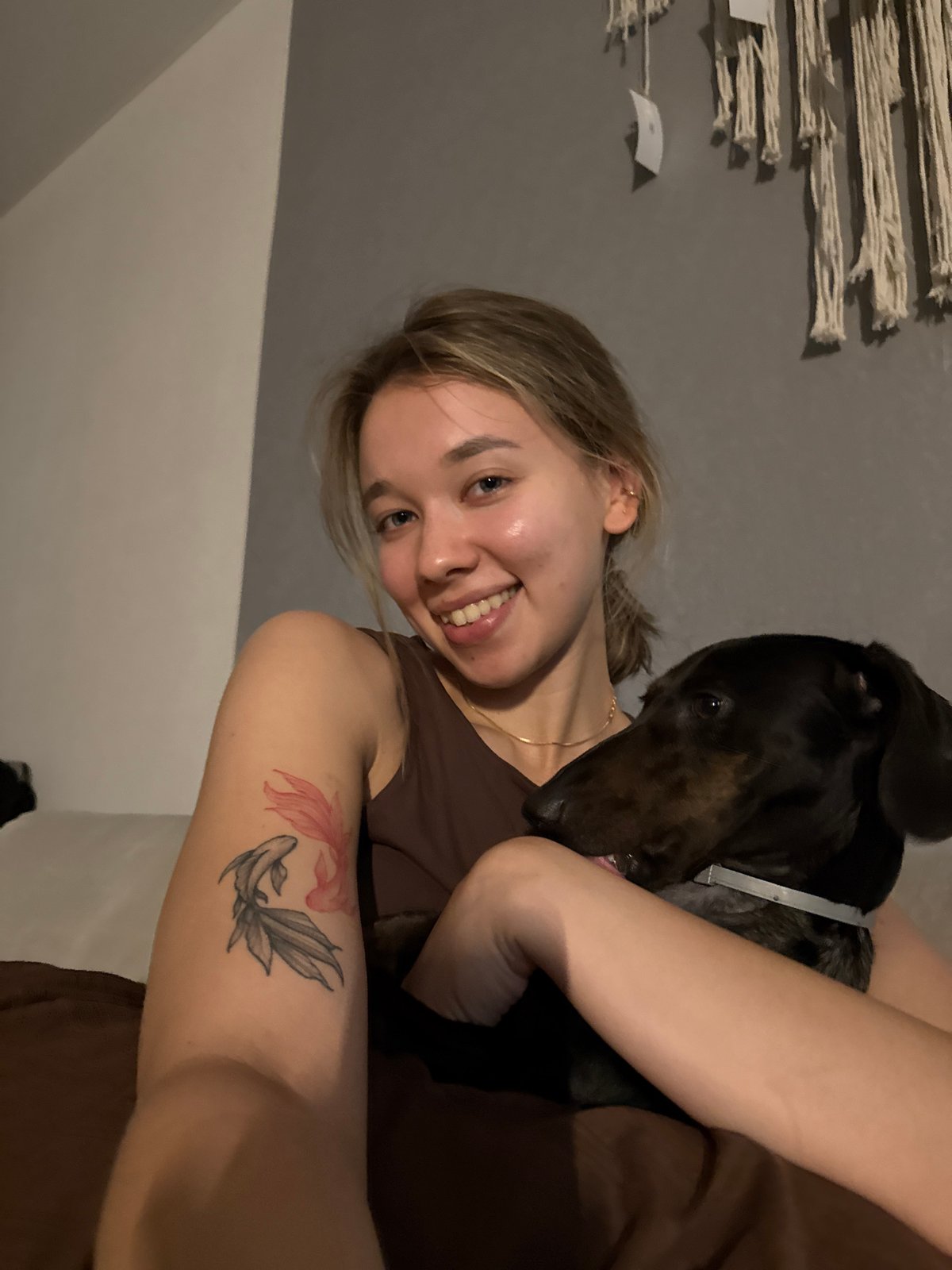 Woman documents afternoon with pets and flowers in Noviy