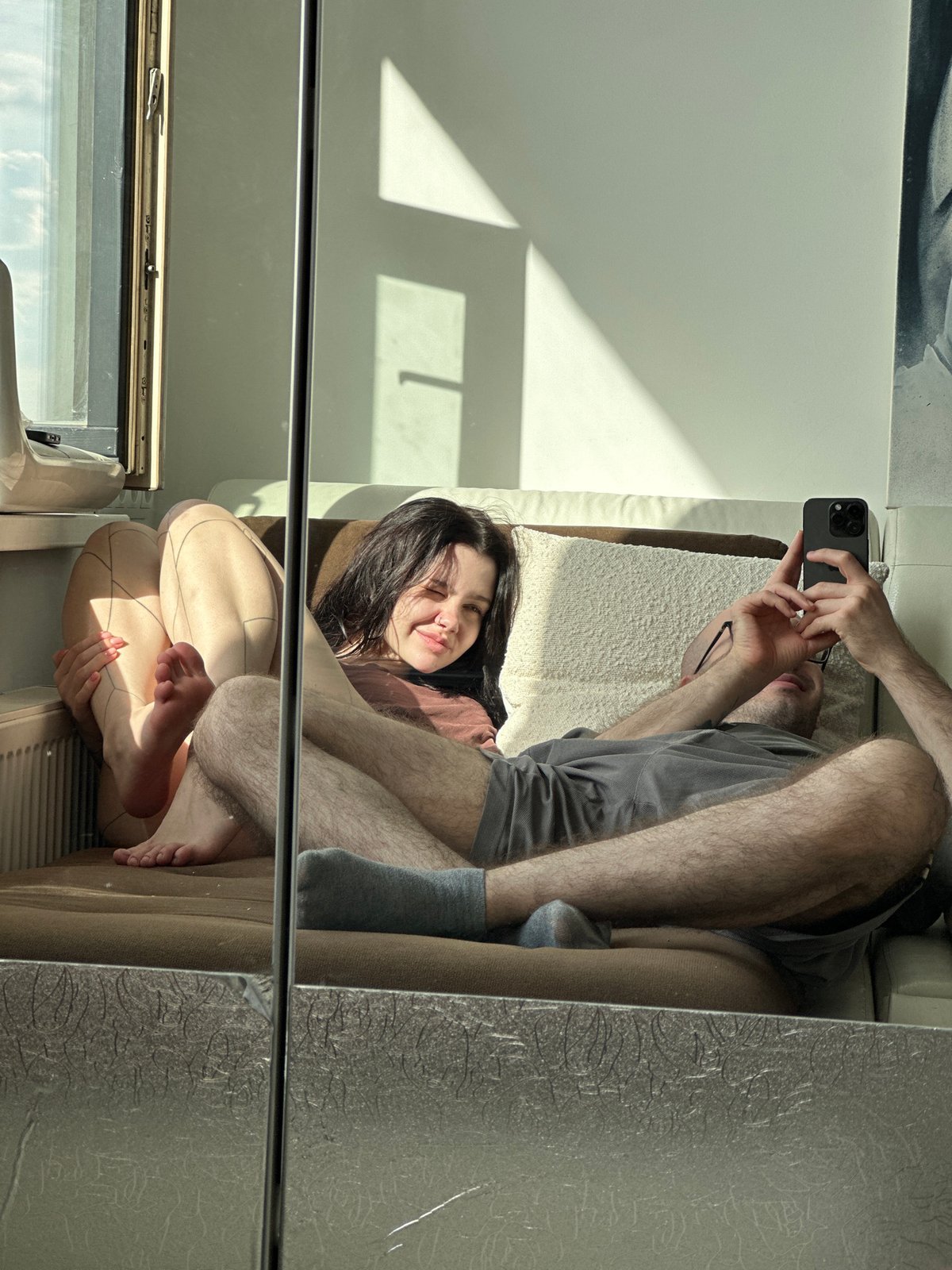 Couple takes mirror selfies in Khimki apartment