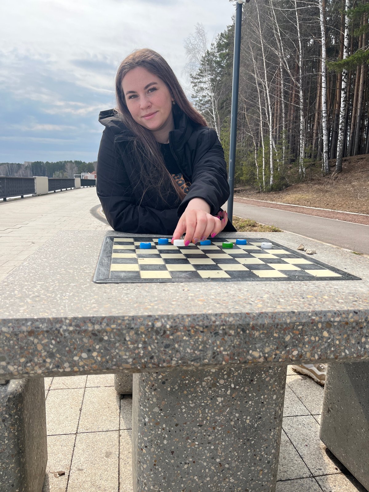 Woman enjoys morning activities at Chaikovsky park