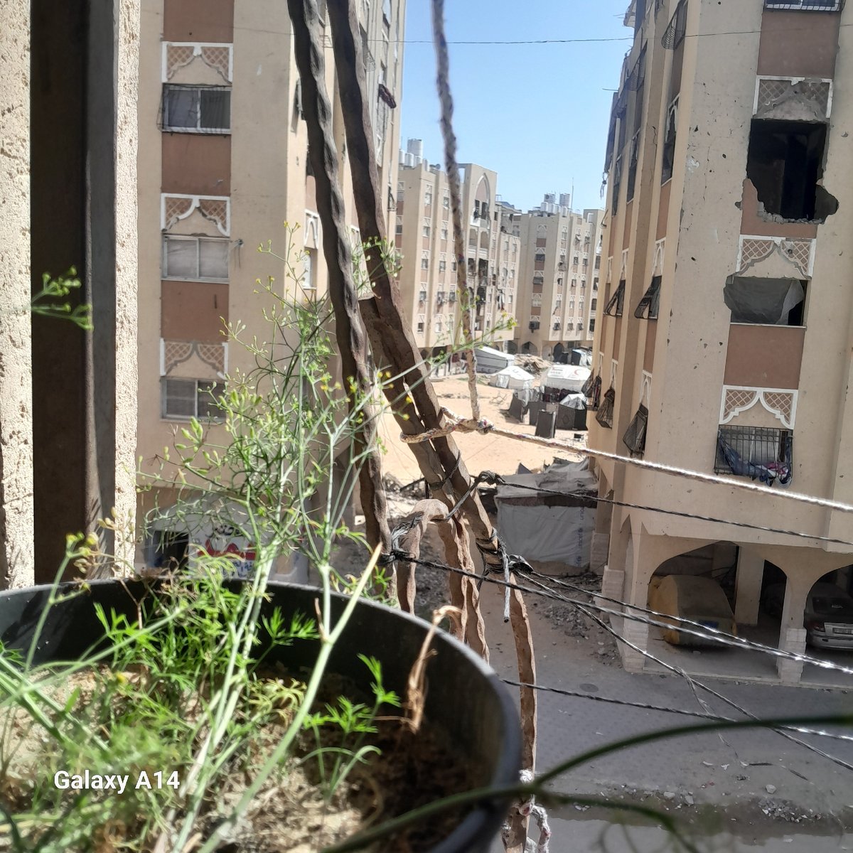 Urban refugee camp observed from multiple elevated viewpoints