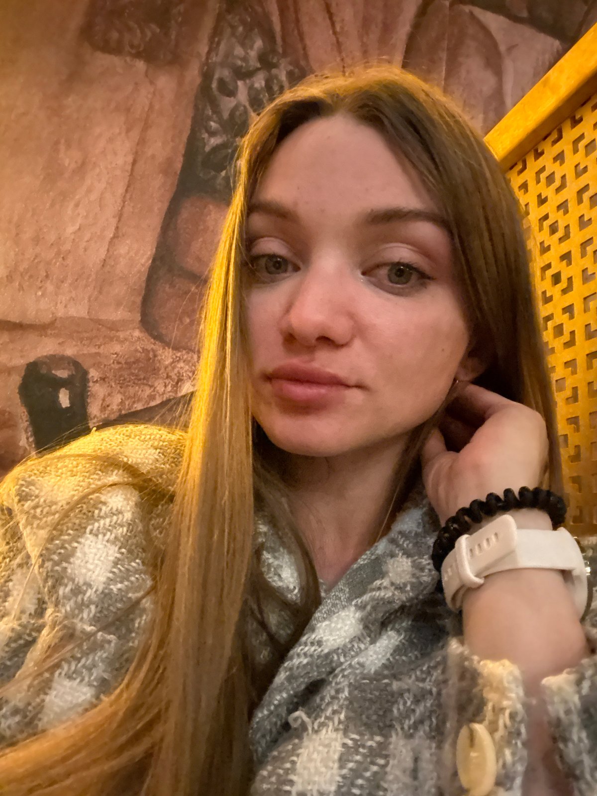 Woman photographs herself indoors in Kazan, Russia