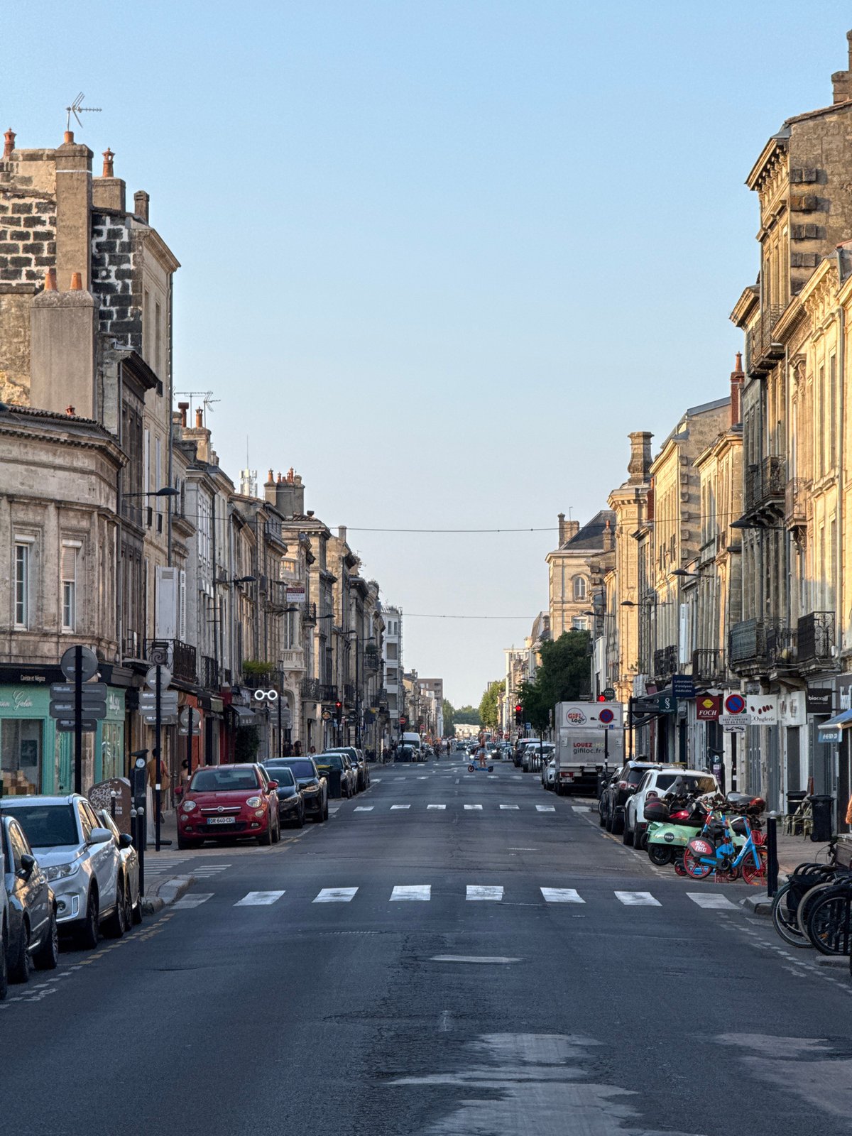 Summer evening across Bordeaux's streets, terraces, and facades