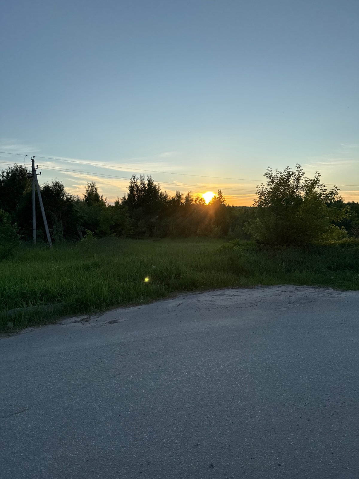 Evening walk documented through Russian village streets during sunset