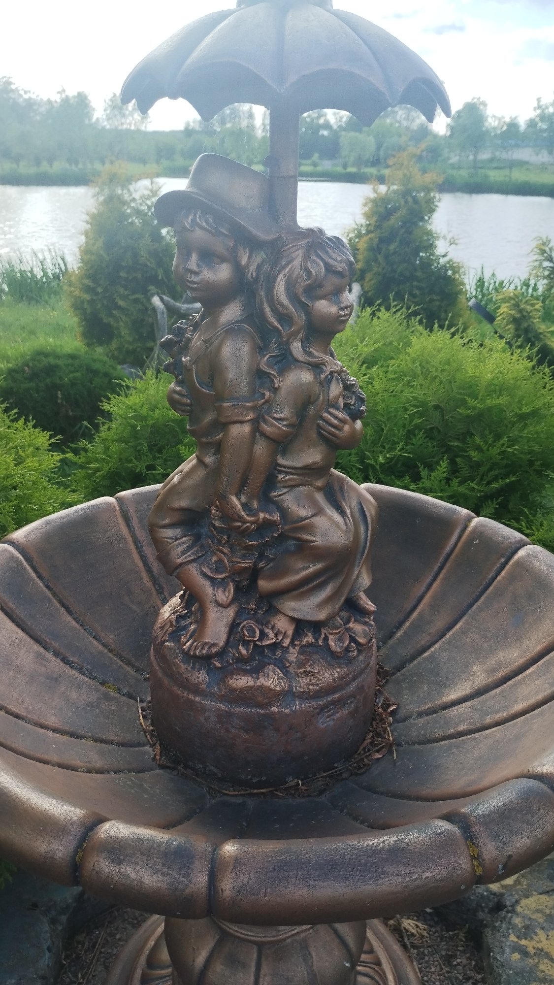 Visitor documents public art and swans in Khmilnyk, Ukraine