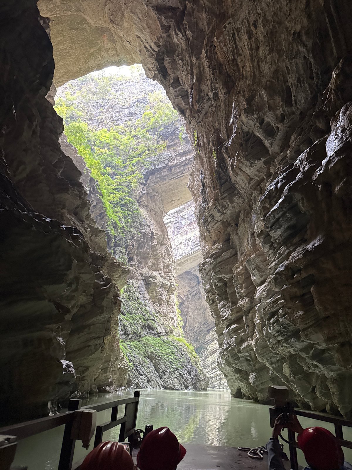 Underground cavern photographed with sunlight streaming through opening