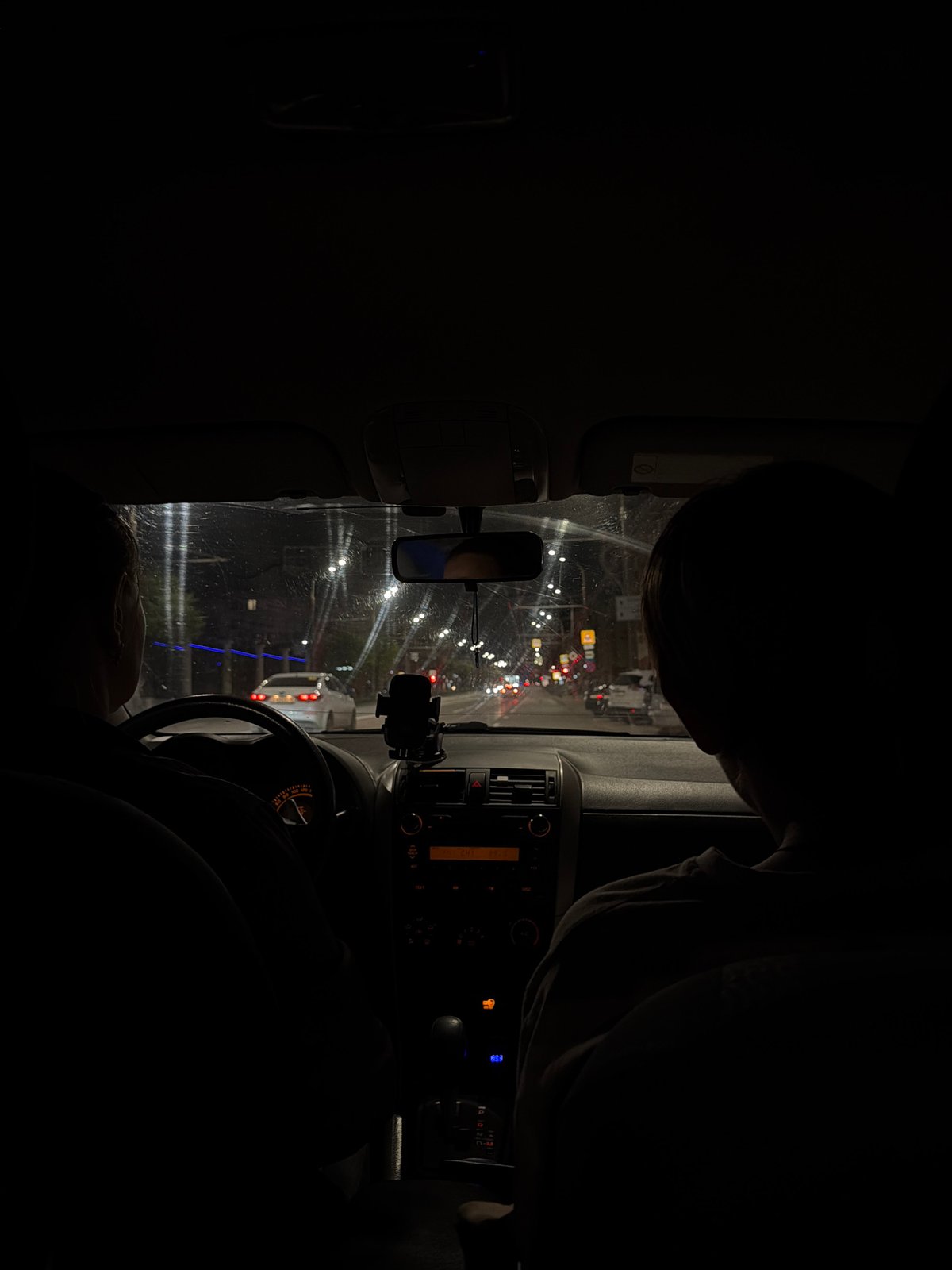 Evening drive through Izhevsk streets captured from vehicle interior