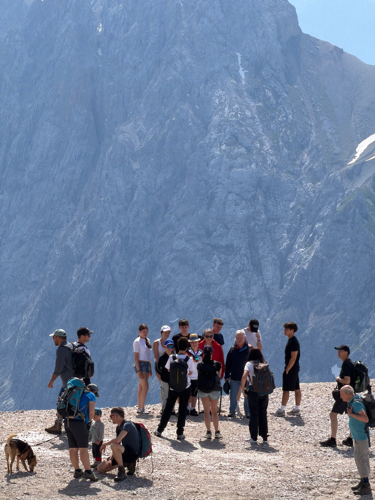 Hikers on rocky alpine terrain above Garmisch-Partenkirchen