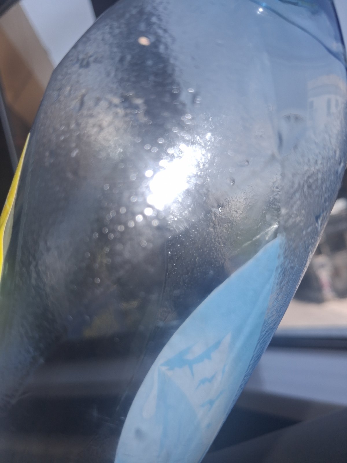 Multiple angles on an ASU water bottle, with eclectic indoor details