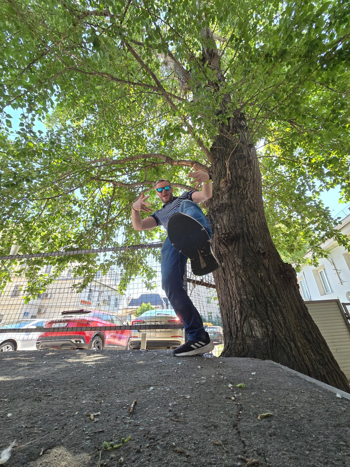 Man poses for photos on Moscow street with skateboard