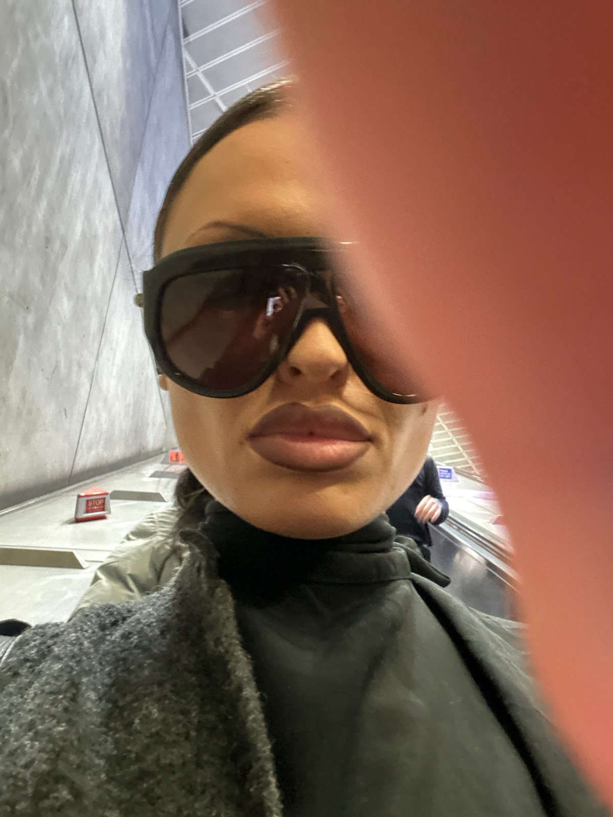Person photographed on London escalator Thursday morning