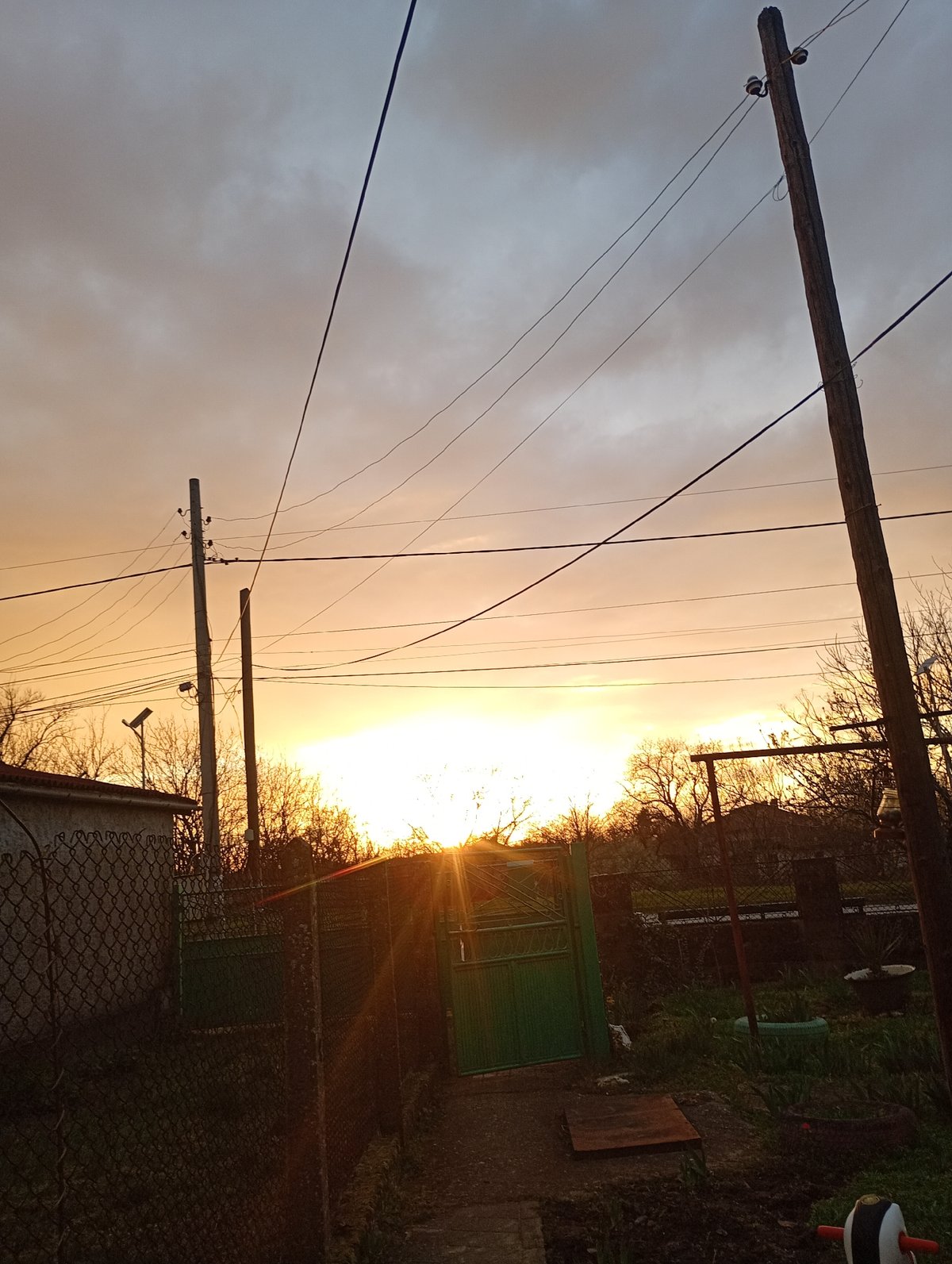 Sunset observed over Alfatar, Bulgaria with silhouetted infrastructure
