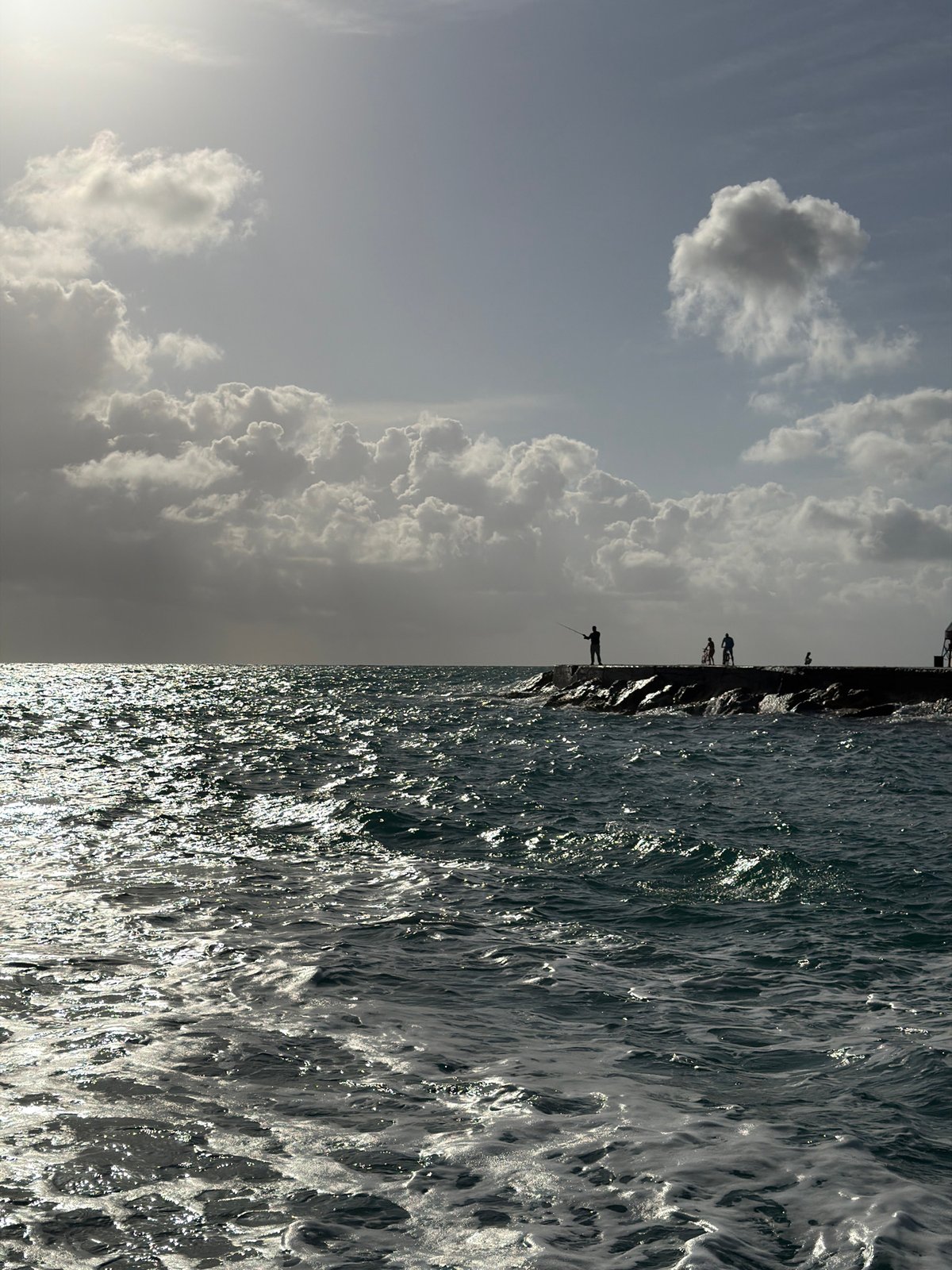 Cloudy skies and ocean views captured at Bal Harbour breakwater