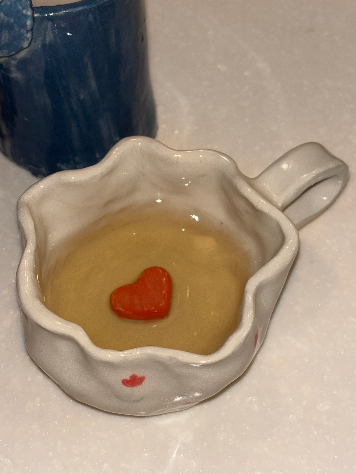 Decorative ceramic mugs documented in Thai coastal town
