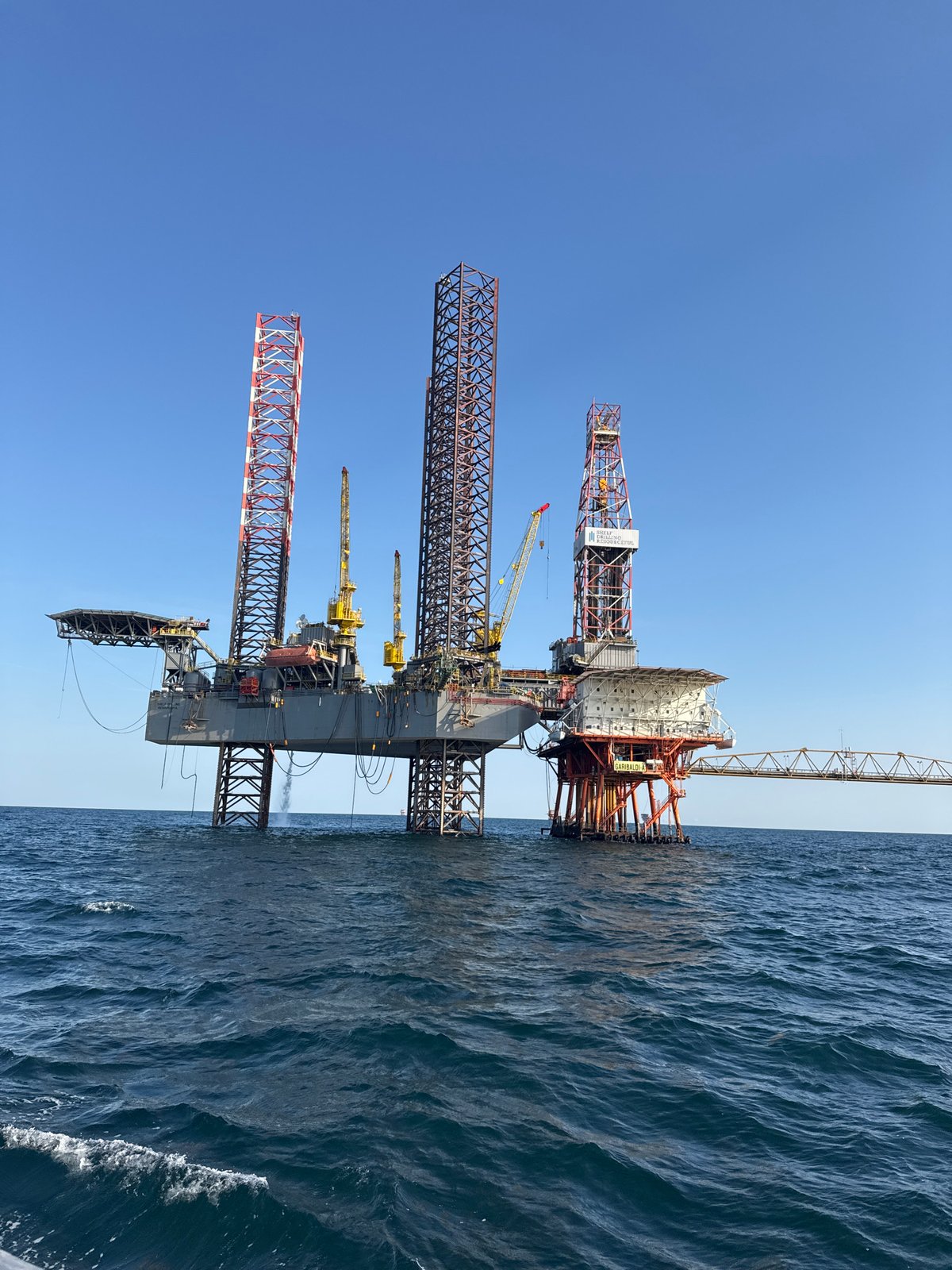 Offshore oil rig in the Adriatic under clear skies