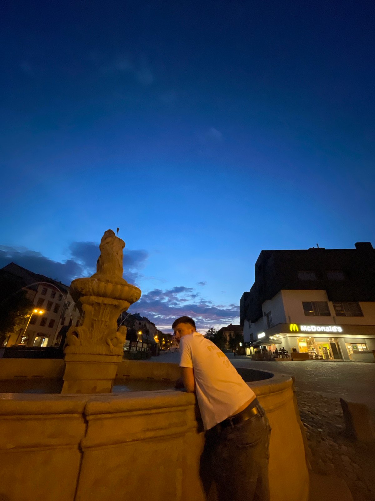 Evening scenes around Jihlava's square, forest, and old building