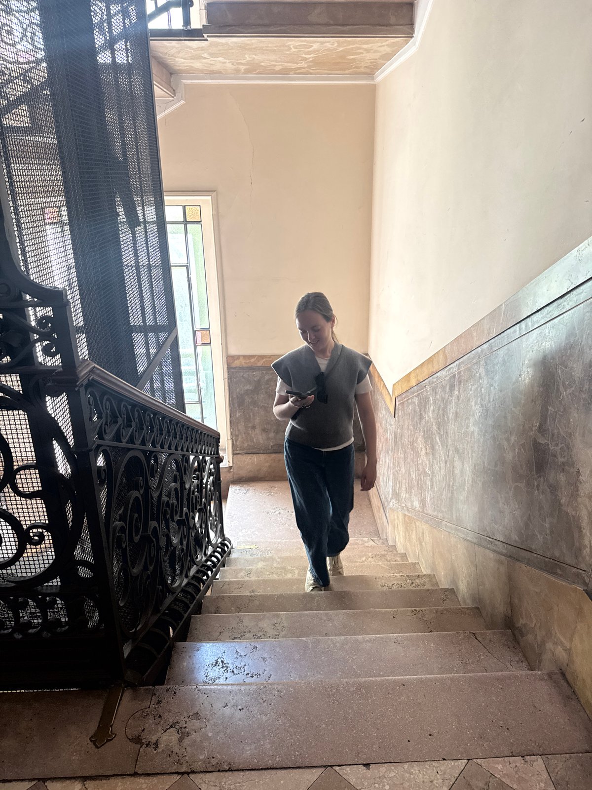 Woman observed in ornate Milan building interior Friday morning