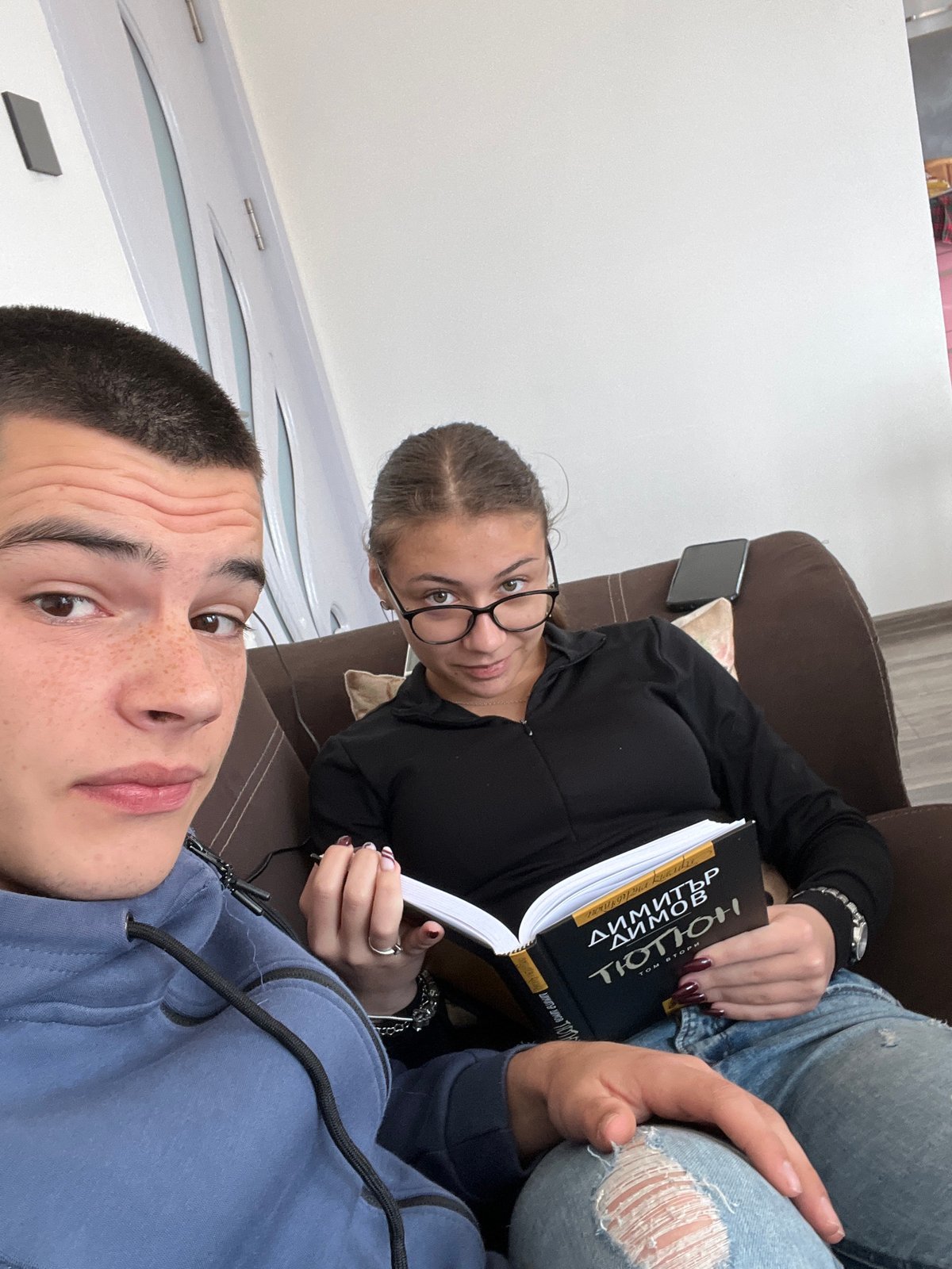 Young couple shares quiet Sunday afternoon in Bulgarian home