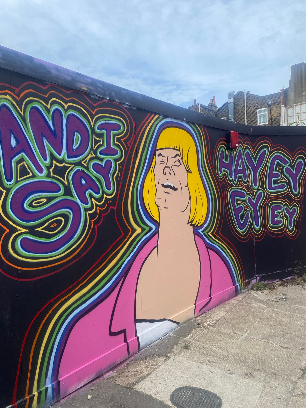 Street art with blonde figure, psychedelic text spotted in London