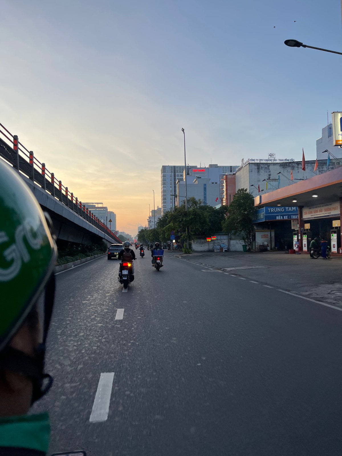 Grab delivery rider travels multi-lane road in Thuận An