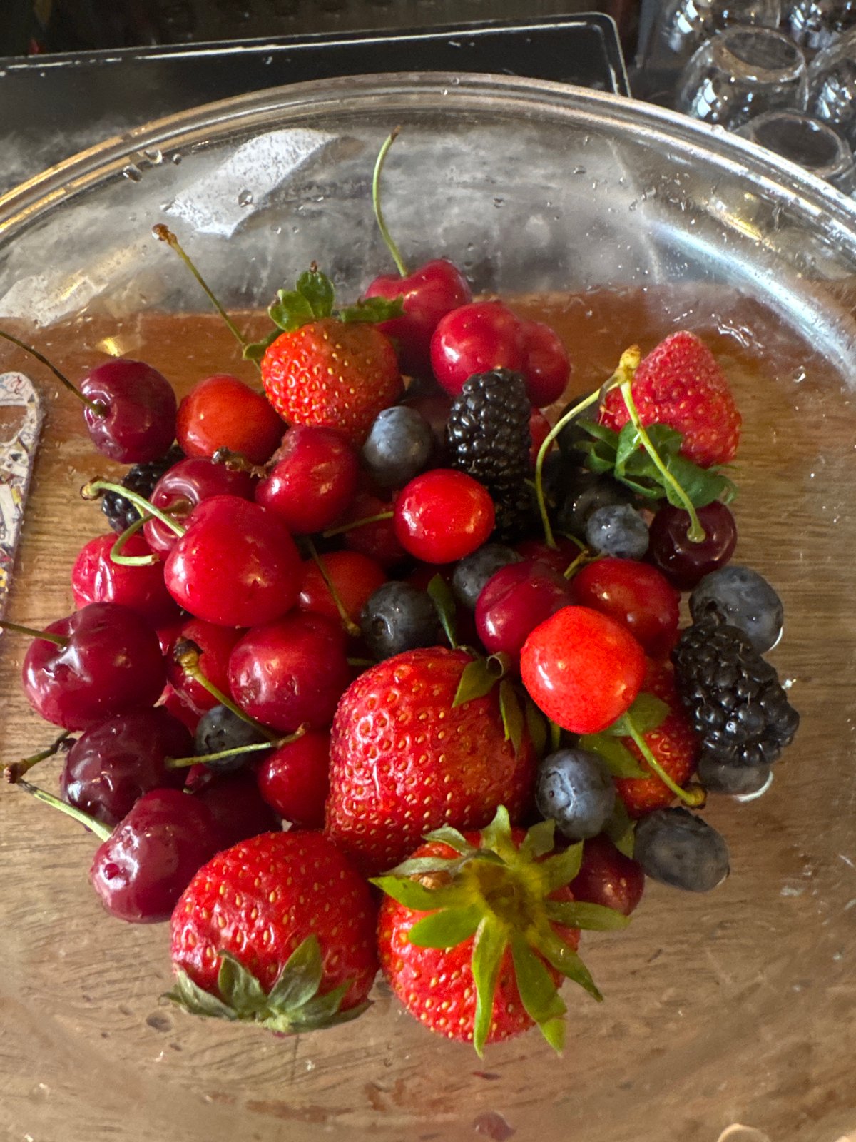 Person carries berry bowl near Sofia escalators Monday morning