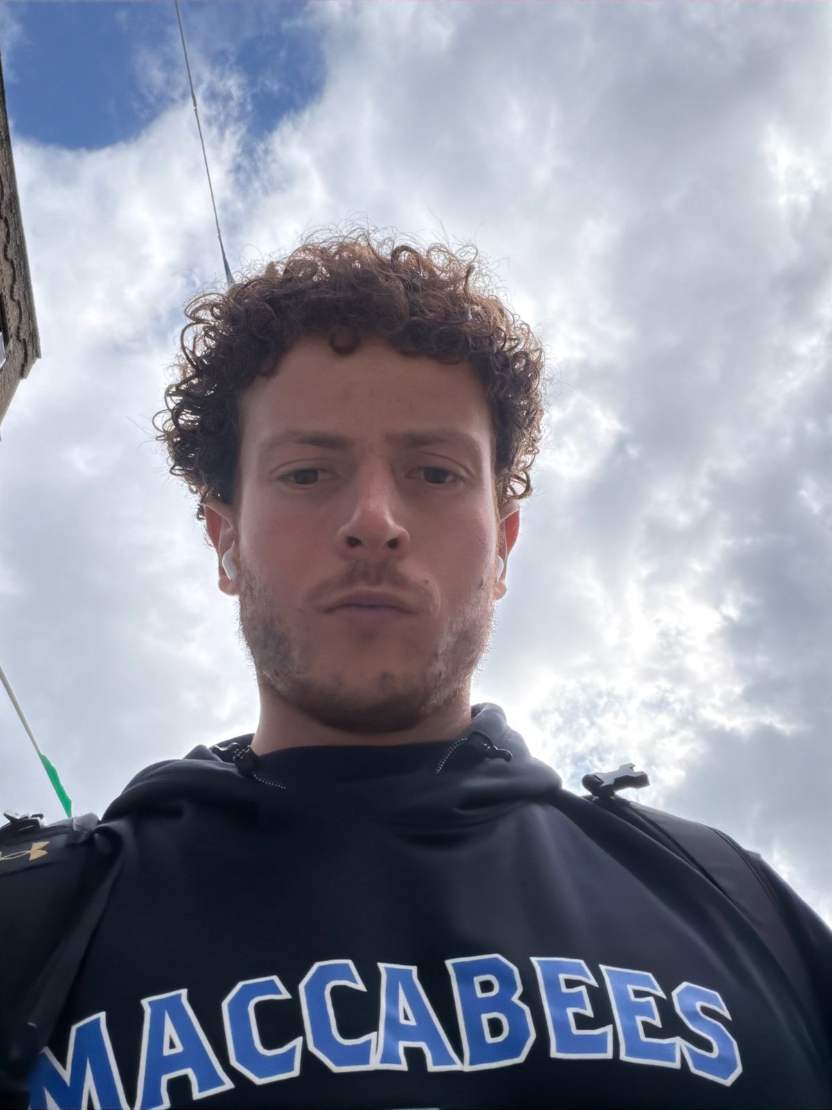 Young man photographed multiple times across NYC locations