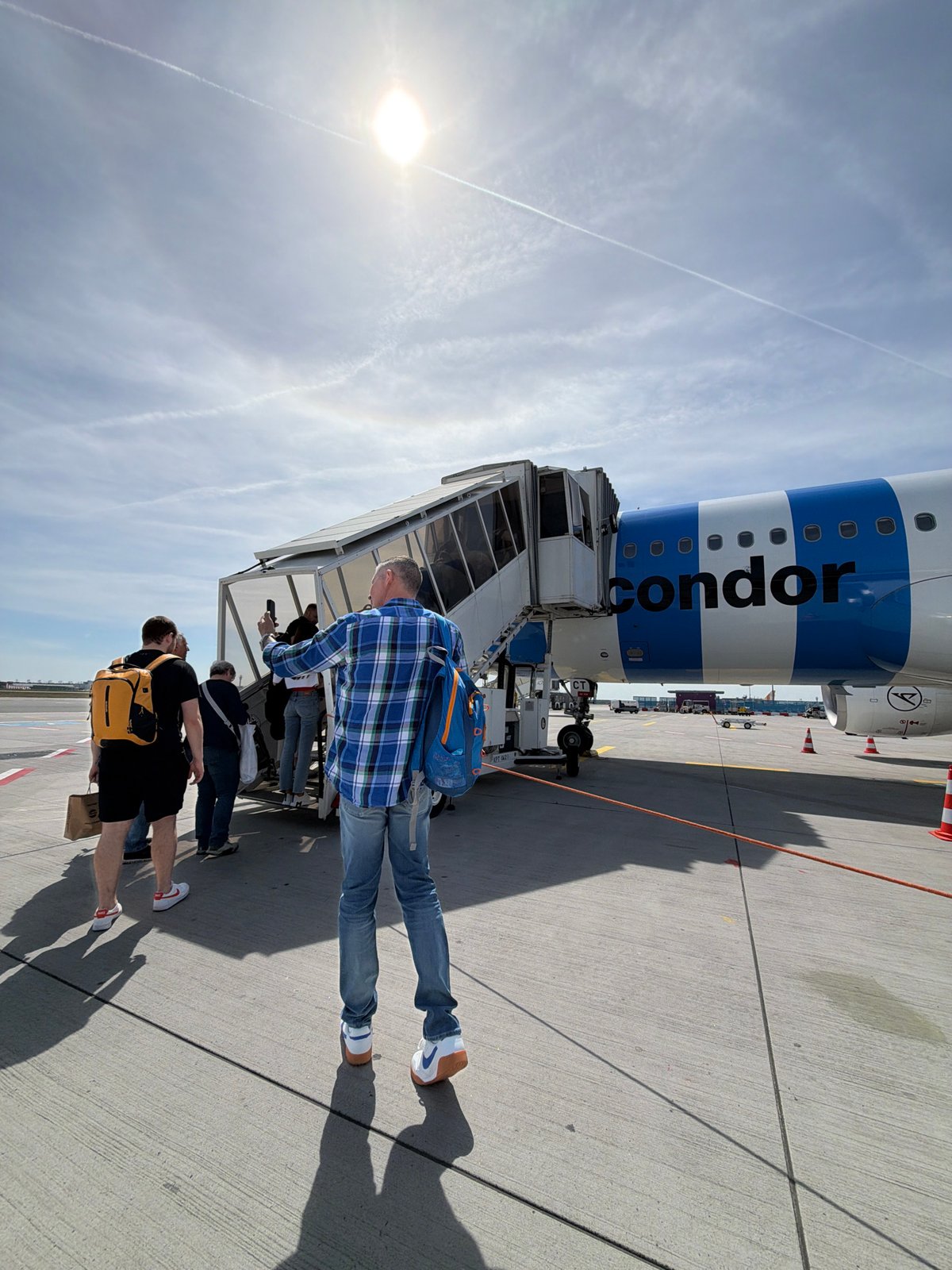 Condor Airlines passengers board, disembark at Frankfurt Airport