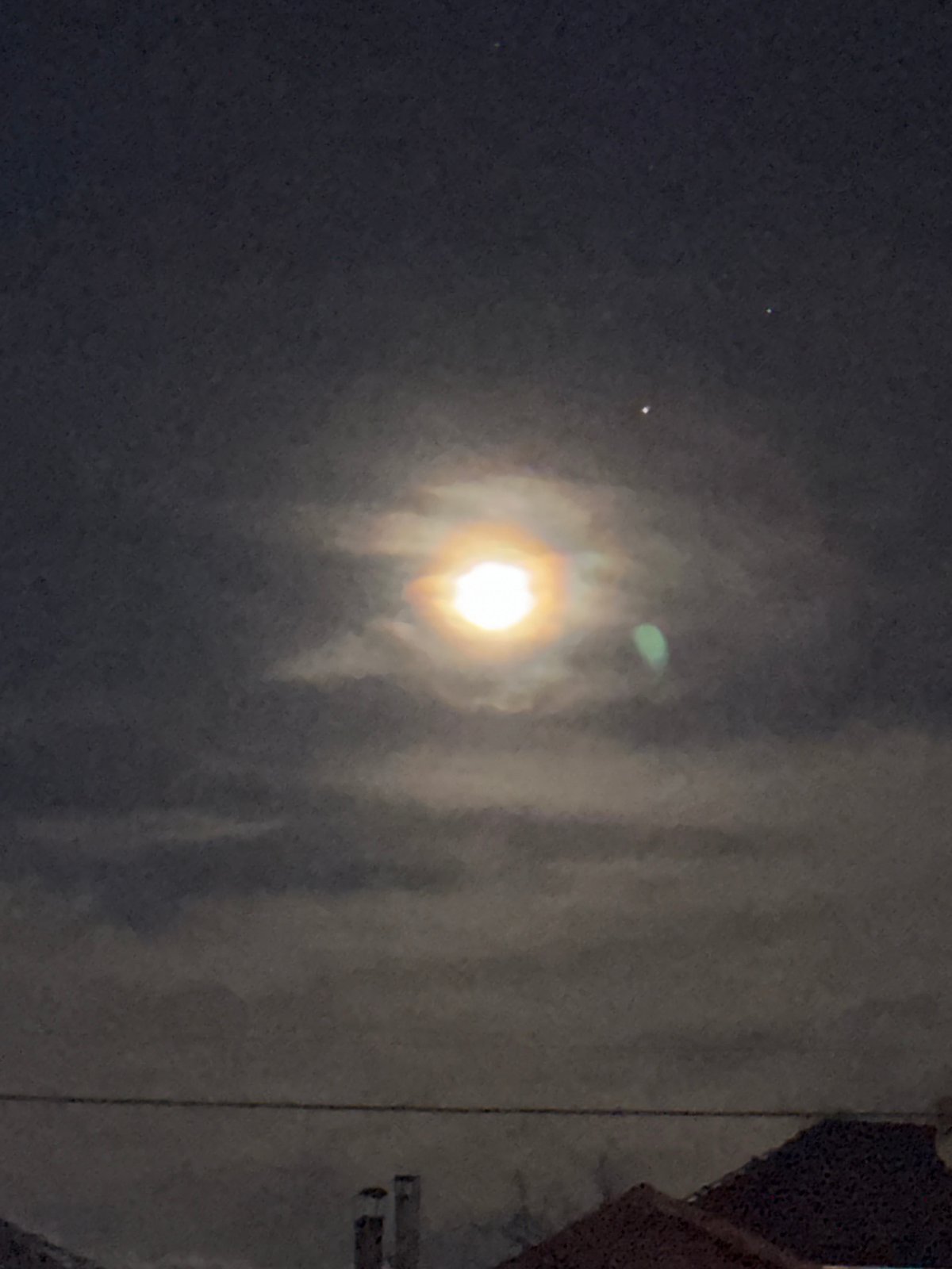 Bright light observed through cloudy night sky in Berkovitsa