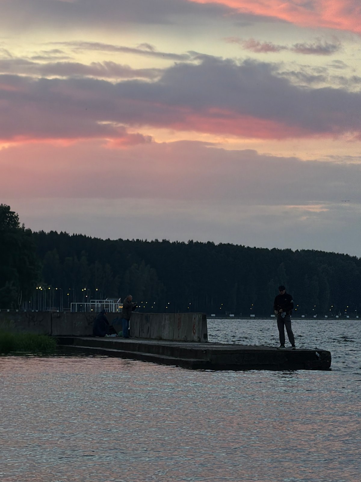 Evening gathering at Kama River during sunset in Chaikovsky