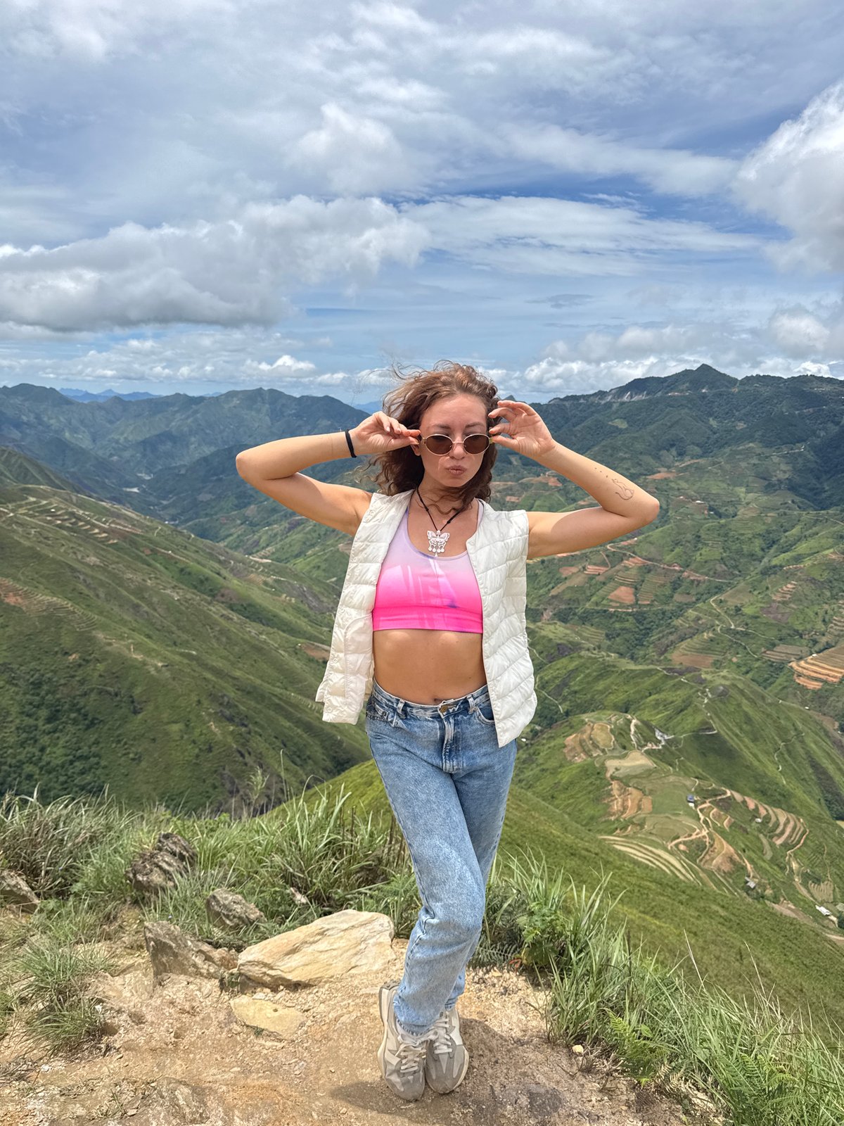 Tourists pose at scenic mountain overlooks in Bắc Yên