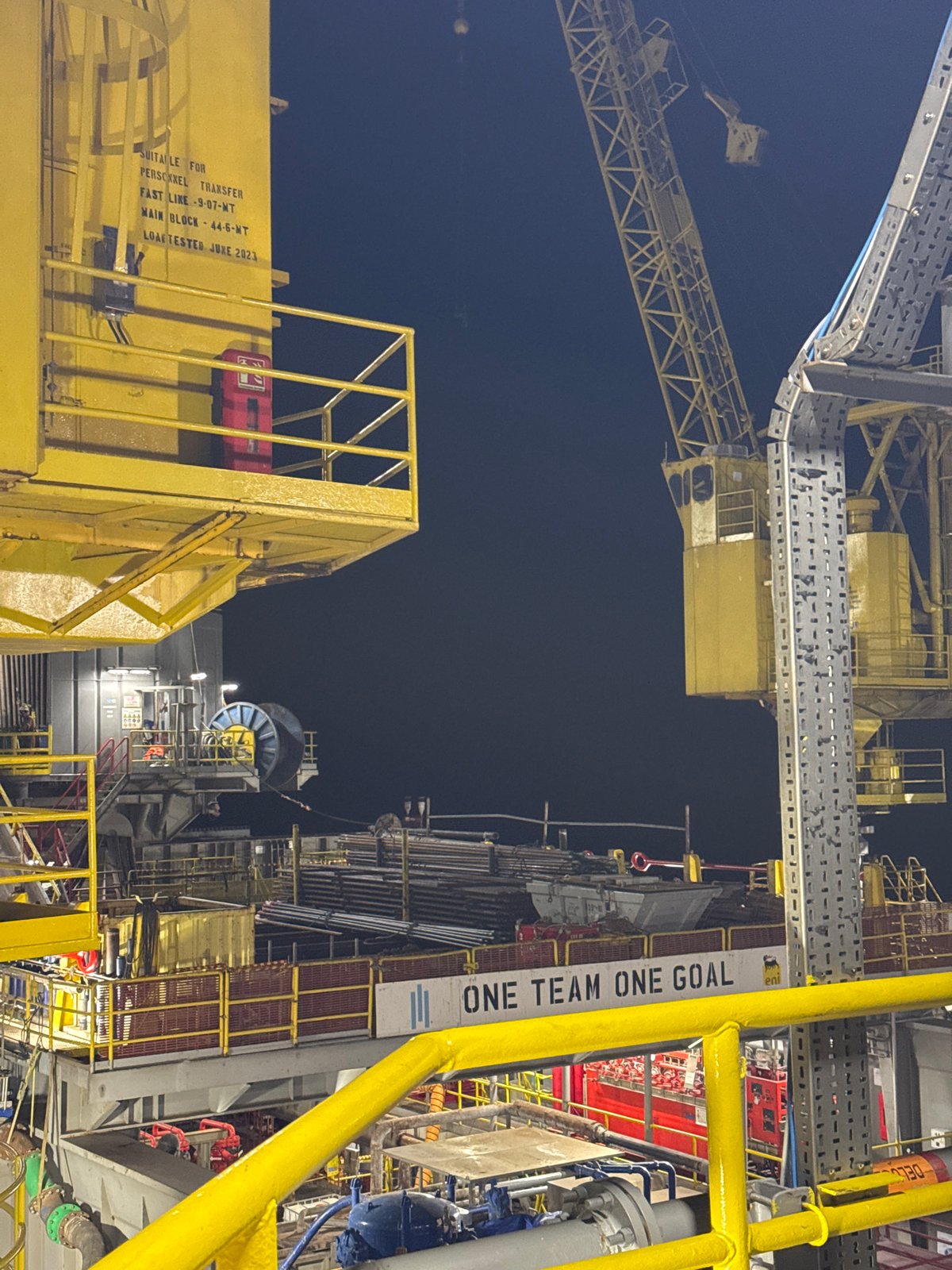 Offshore oil rig operations documented near Italy at night