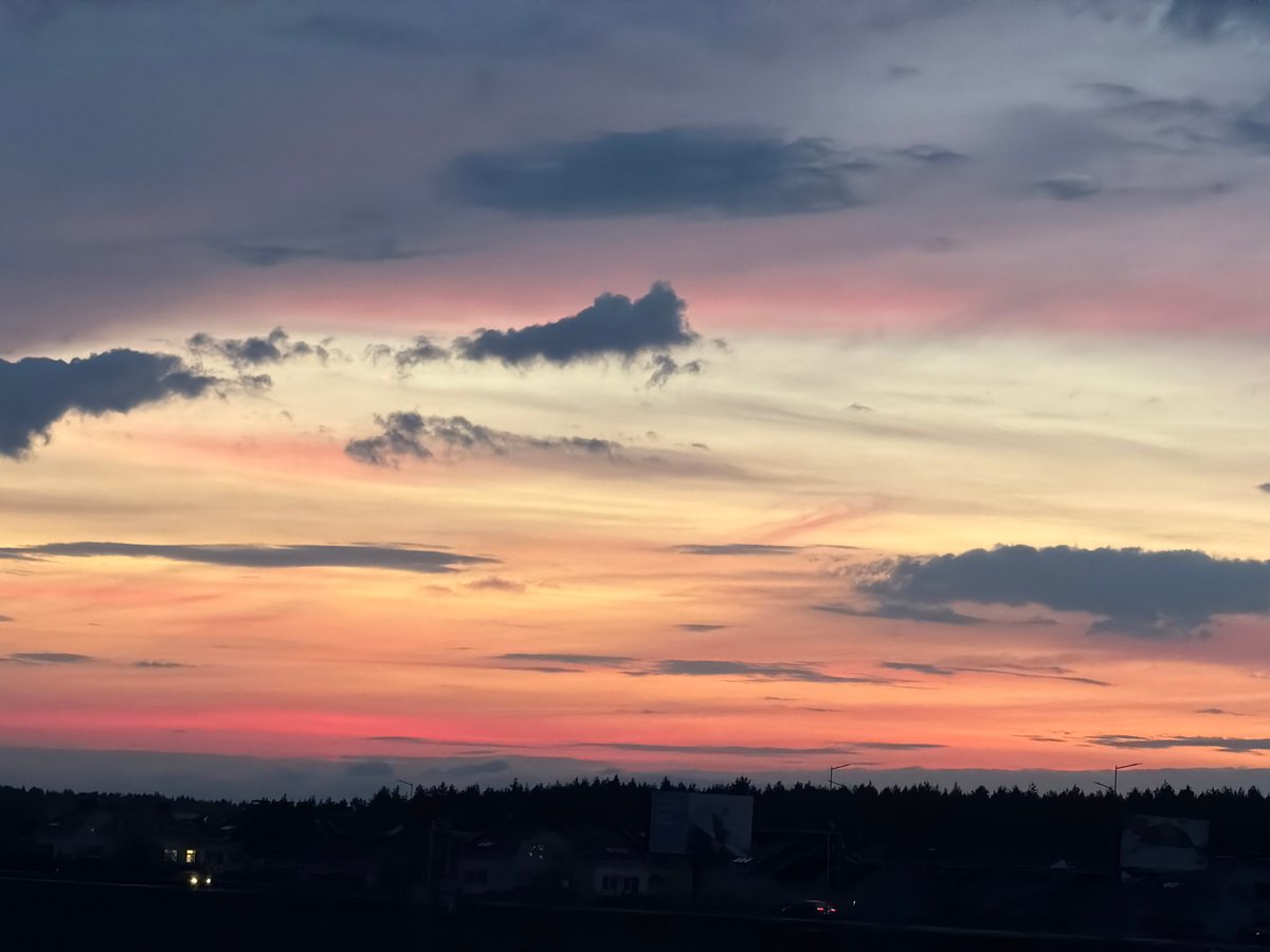 Twilight scenes documented in rural Belarus village during evening hours