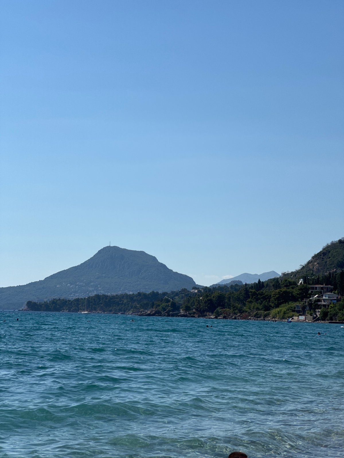 Wading at the pebble shore of Šušanj, Montenegro