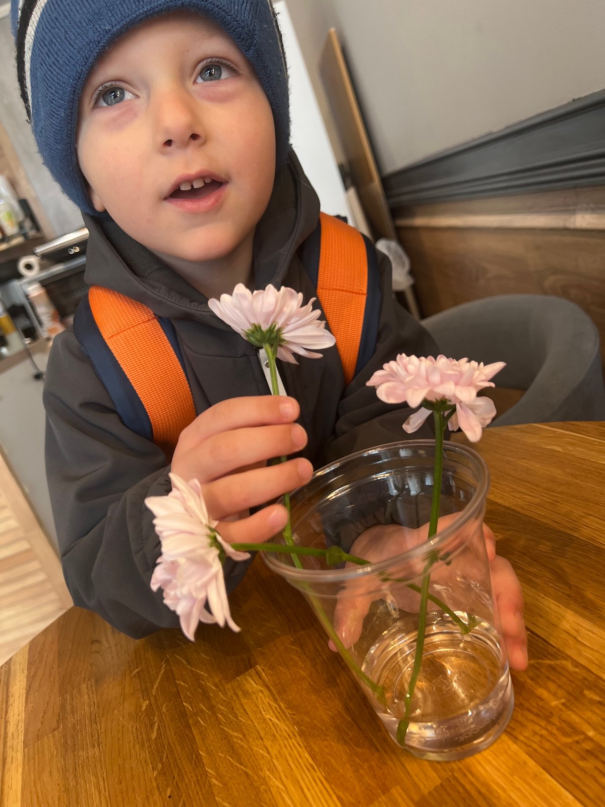 Child with flowers visits Mytishchi cafe with dog