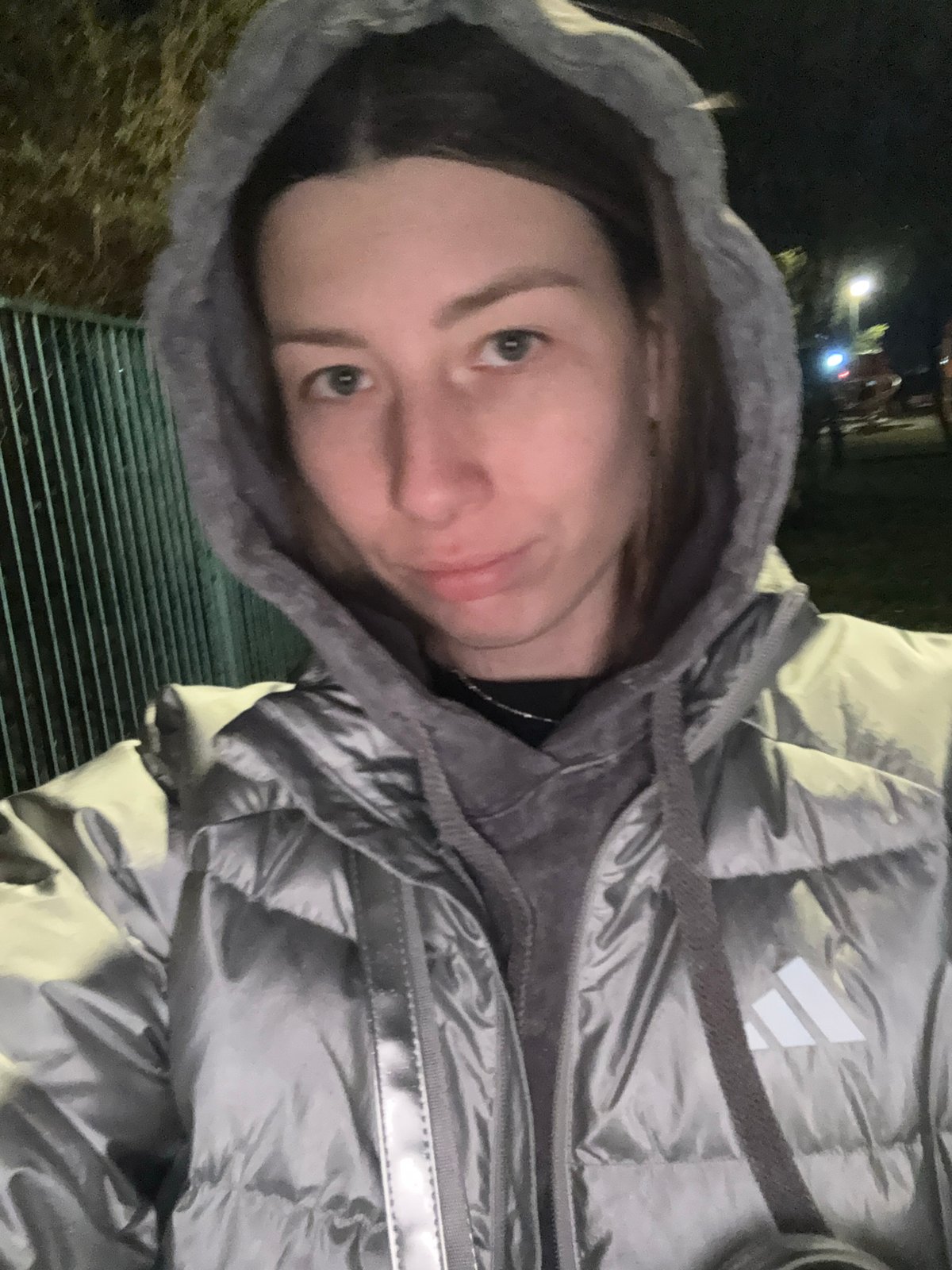 Nighttime walk documented in wet Moscow residential area