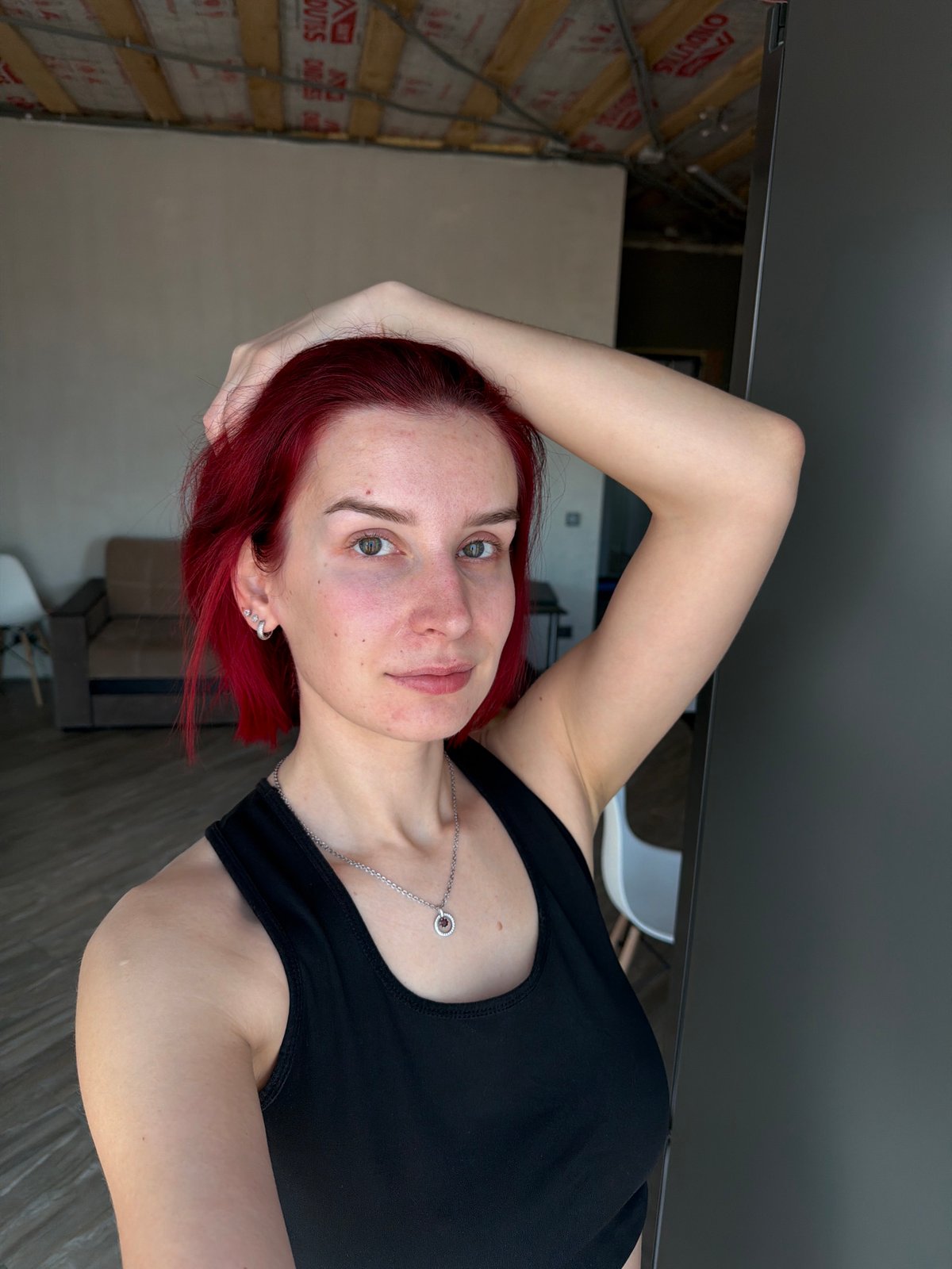 Woman takes selfies indoors in Chaikovsky, Russia