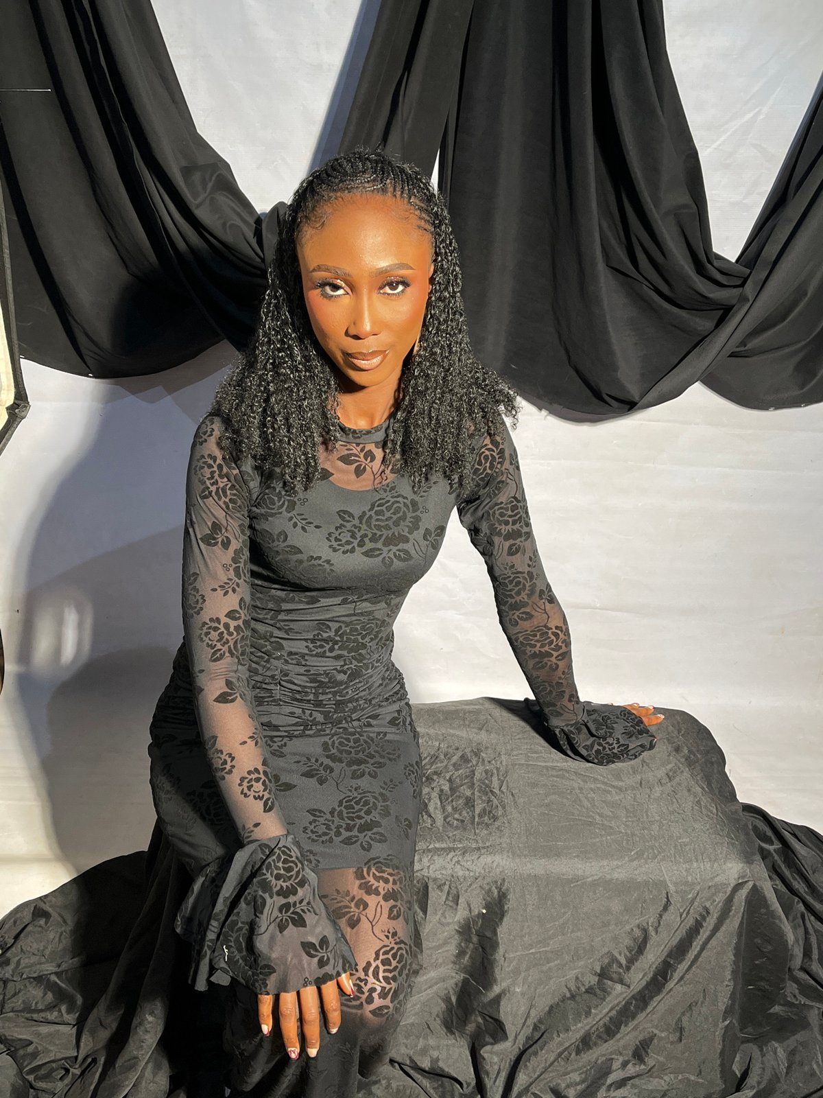 Studio fashion shoot in Jos, Nigeria — black floral dress, multiple poses