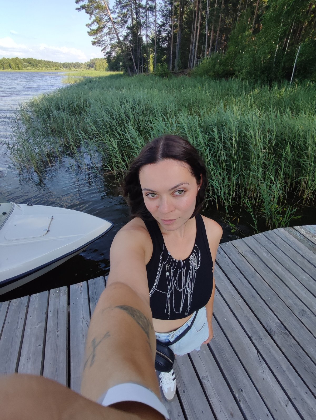 Sunny afternoon on a Kama River pier in Chaykovsky
