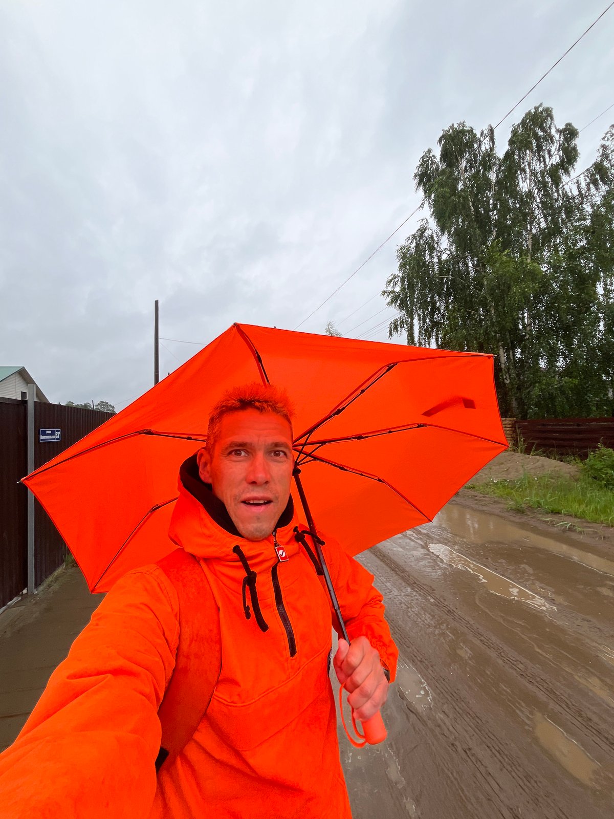 Rainy day selfies on a muddy road in Chaikovsky, Russia