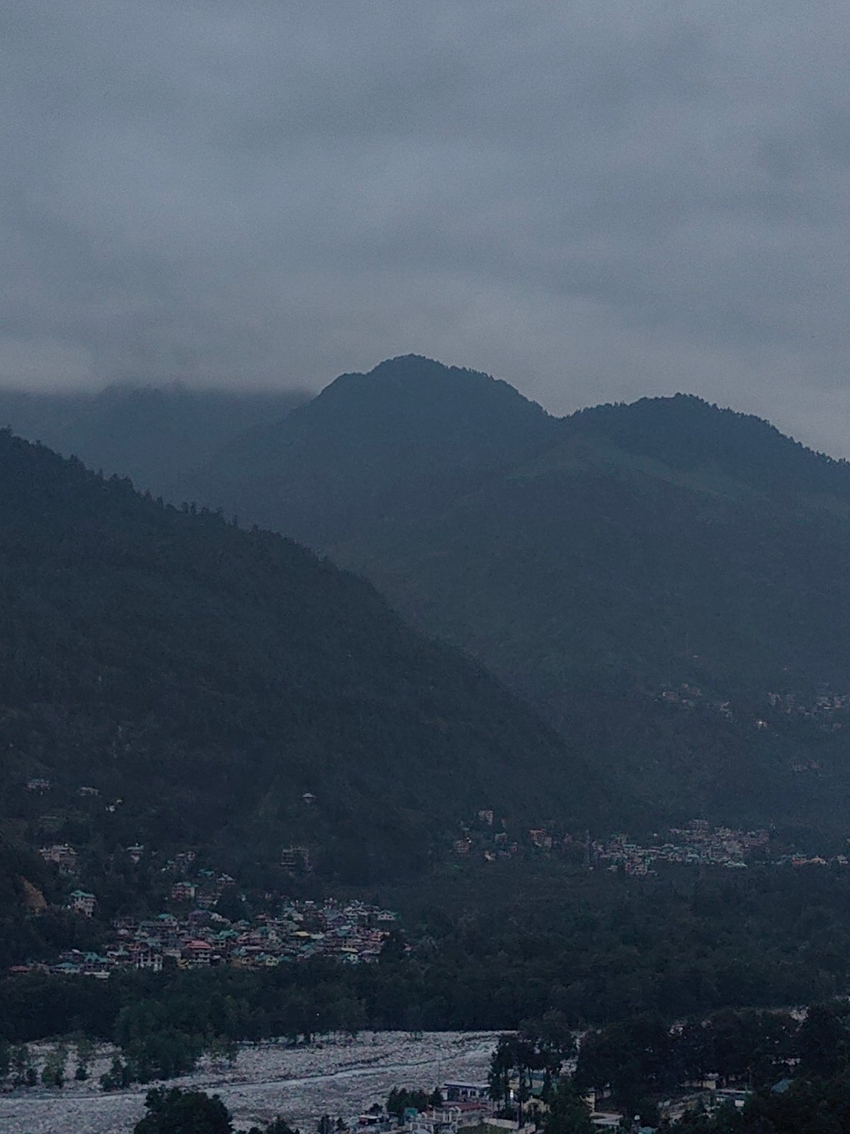 Cloudy morning across Vashisht's valley, forests, and mountain peaks