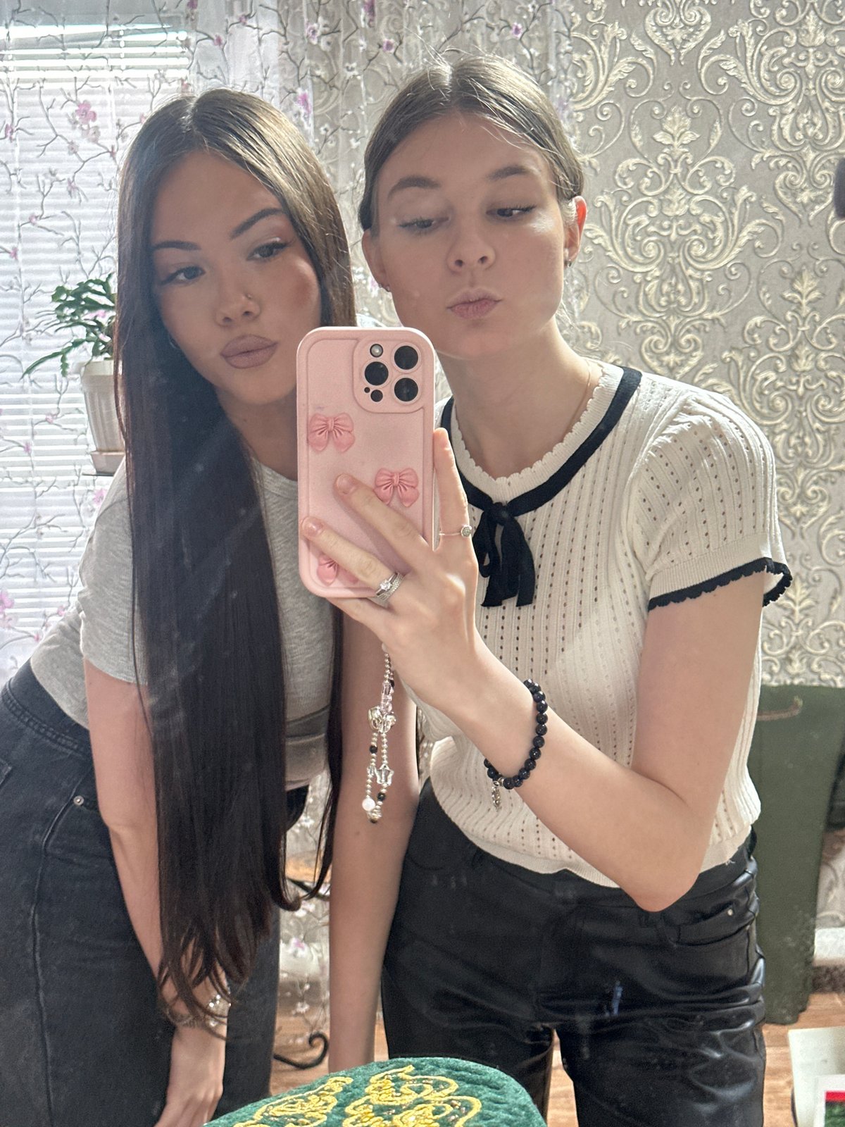 Friends take mirror selfies in Russian village home