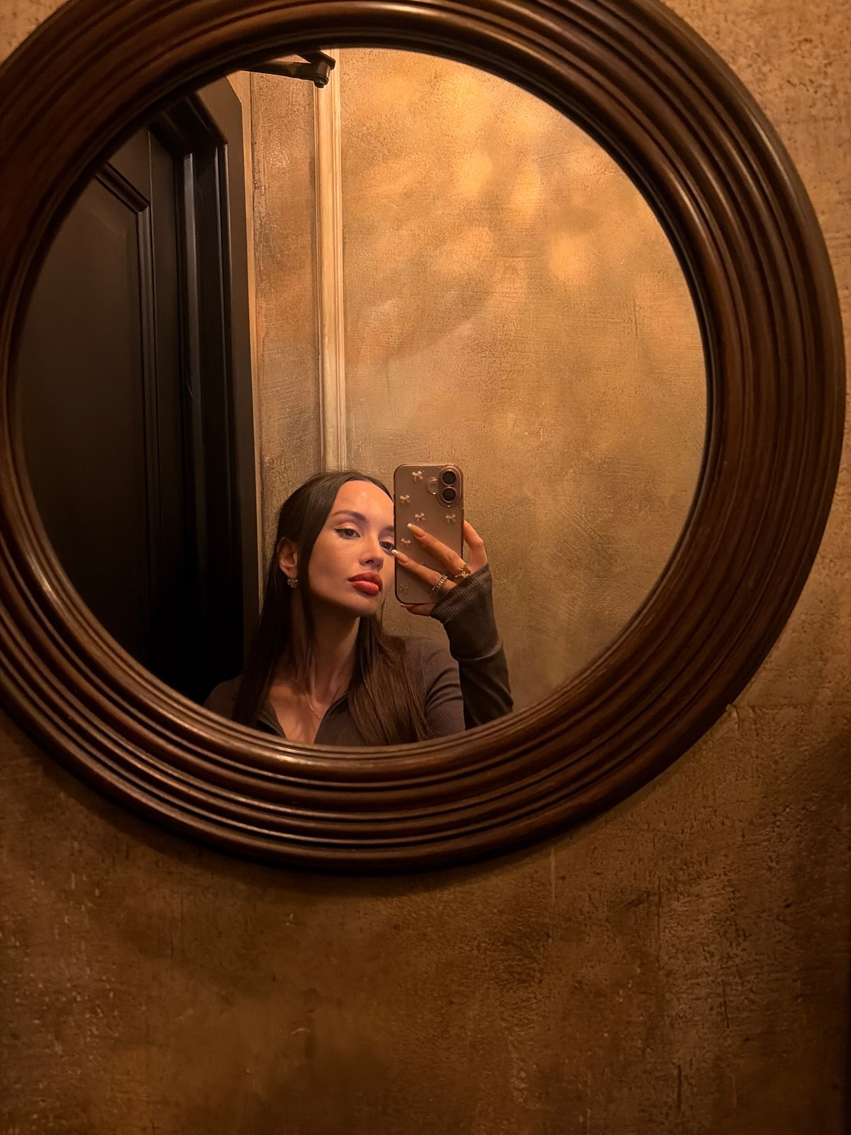 Woman takes bathroom selfies at Saint Petersburg restaurant