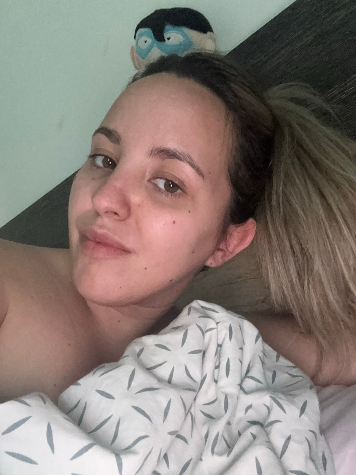 Woman photographed in intimate bedroom portrait in Sofia