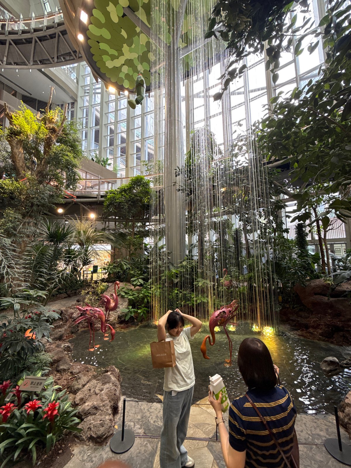 Visitors explore themed shopping mall attractions in Liangjiang, China
