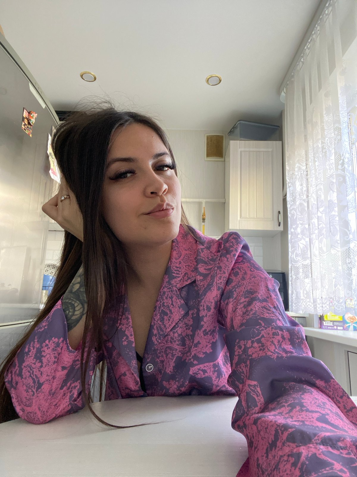 Woman photographed in kitchen poses in Chaikovsky, Russia