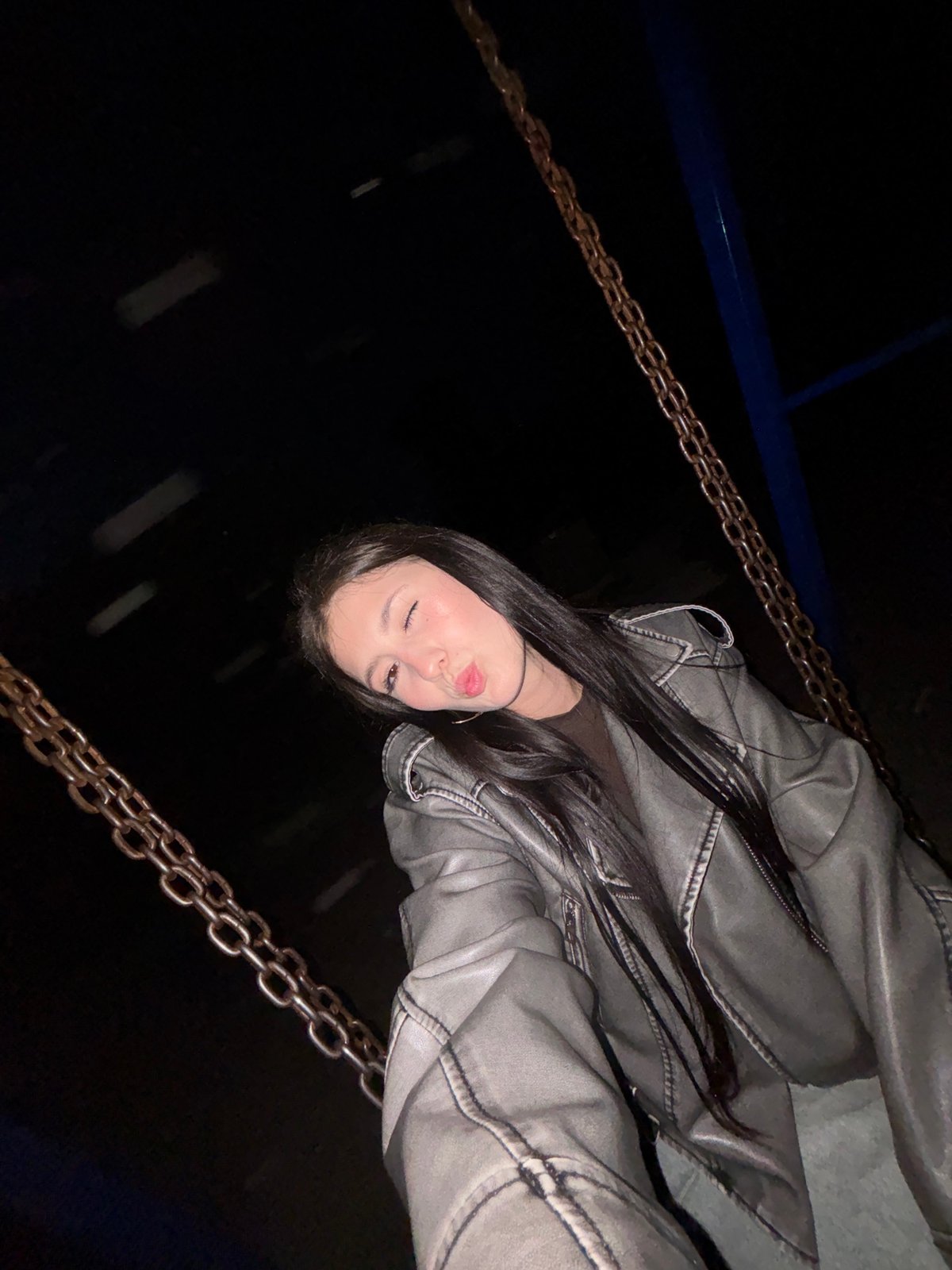 Woman photographs evening visit to playground in Фоки, Russia
