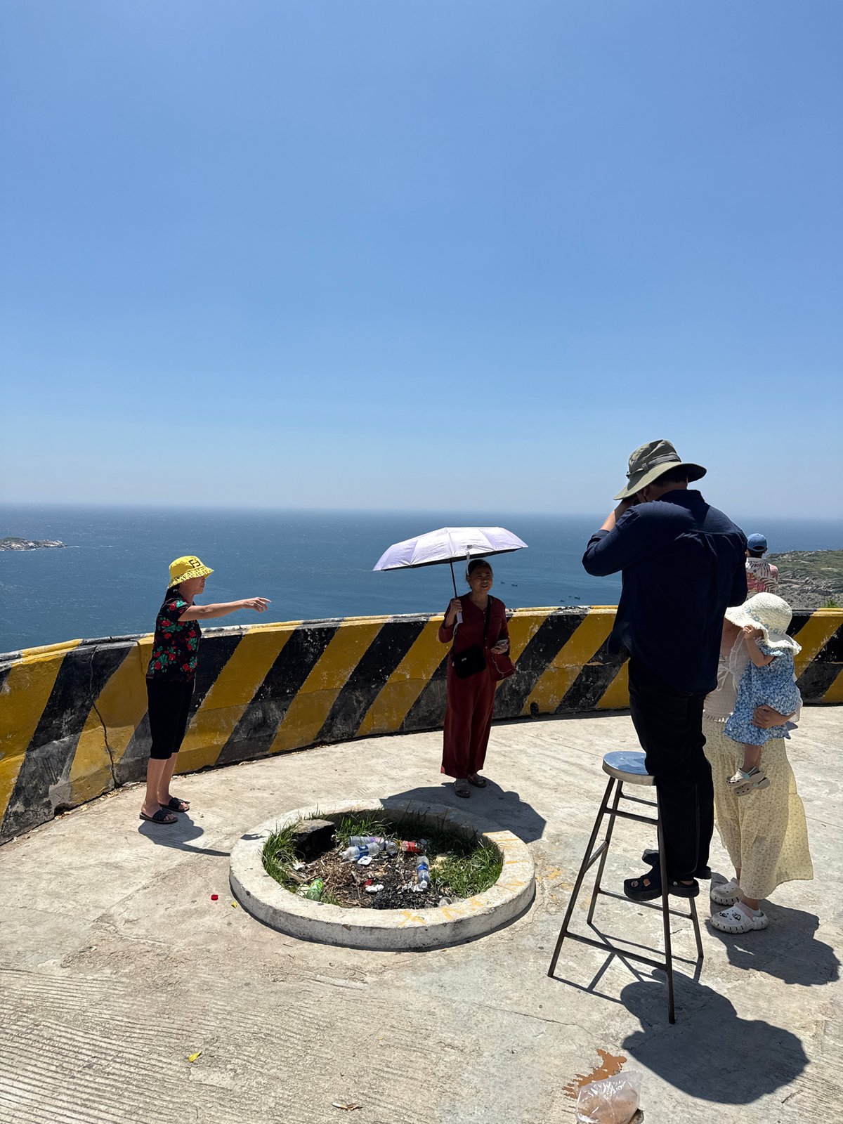 Family visits coastal overlook in Vinh Hai, Vietnam