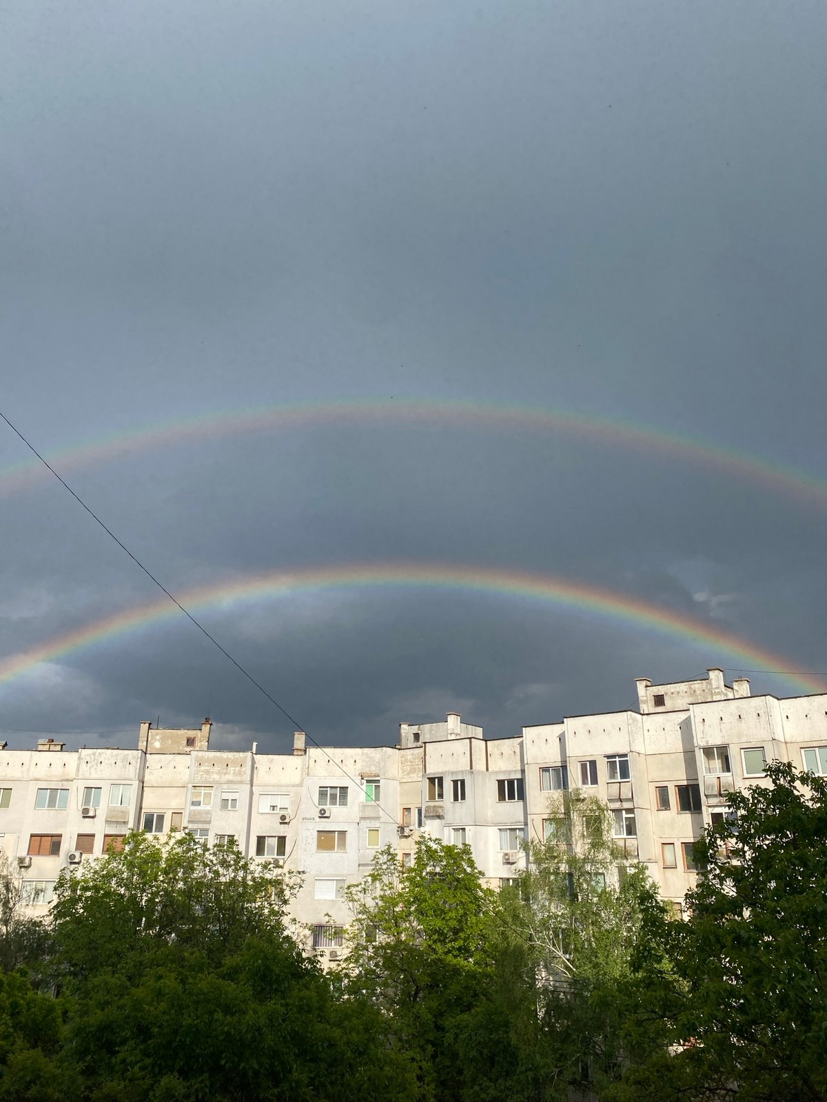 Double rainbow appears over Pleven apartment buildings after storm