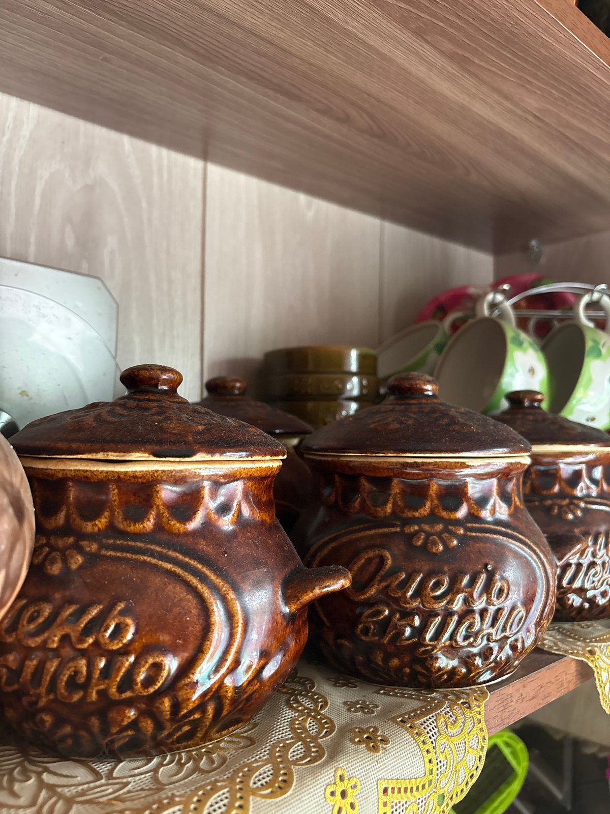 Traditional Russian ceramic folk pottery on shelves in Vetluzhsky