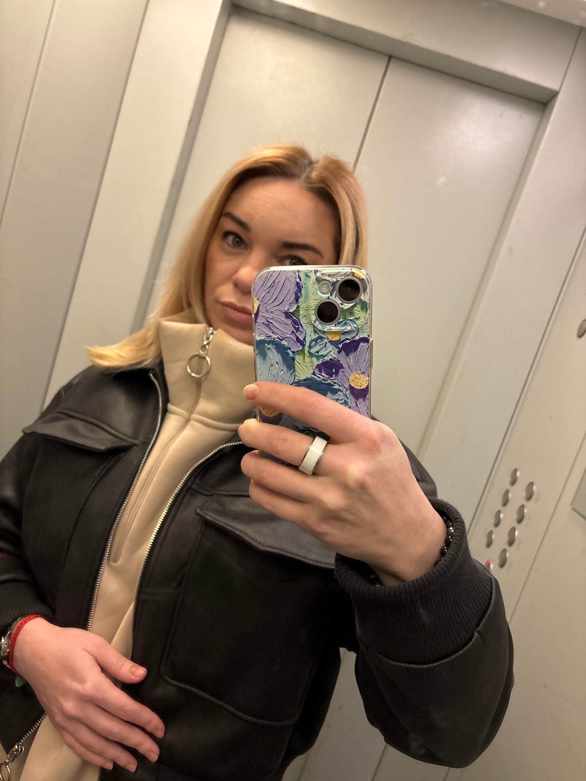 Woman takes elevator selfie in Vsevolozhsk, Russia