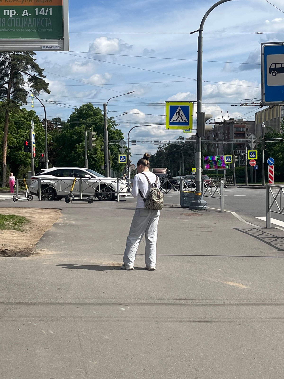 Woman spotted standing roadside in Saint Petersburg street scene